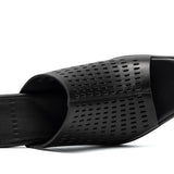 perforated black leather sandal with red and blue architectural heel top
