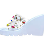 white platform wedge slip on sandal with multi-colored jewel side