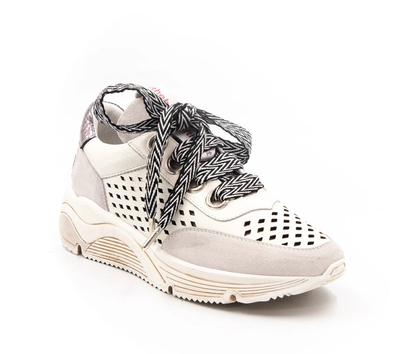 neutral colored perforated platform sneaker with metallic detail backing and patterned laces side profile