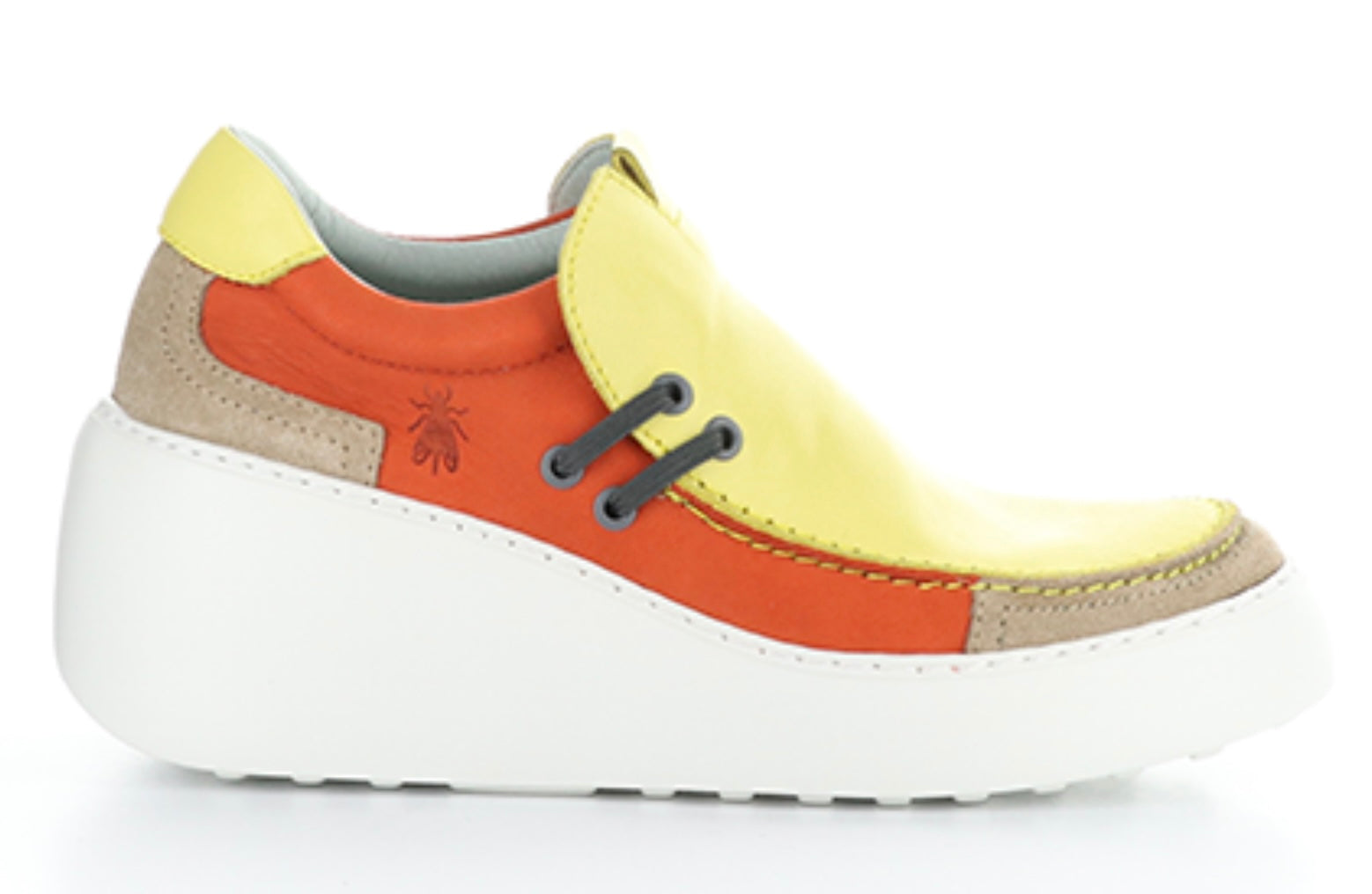 yellow orange and white platform wedge slip on sneaker detail view
