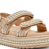 gold detail on raffia texture platform sandal with multiple adjustable straps side front view