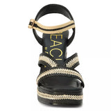 black and tan woven material platform block heel sandal with adjustable ankle strap from front