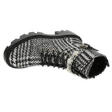 black and white houndstooth style design chunky heeled platform booth with pearl like embellishments on strap. Features side zipper and black shoe laces. Side flat view