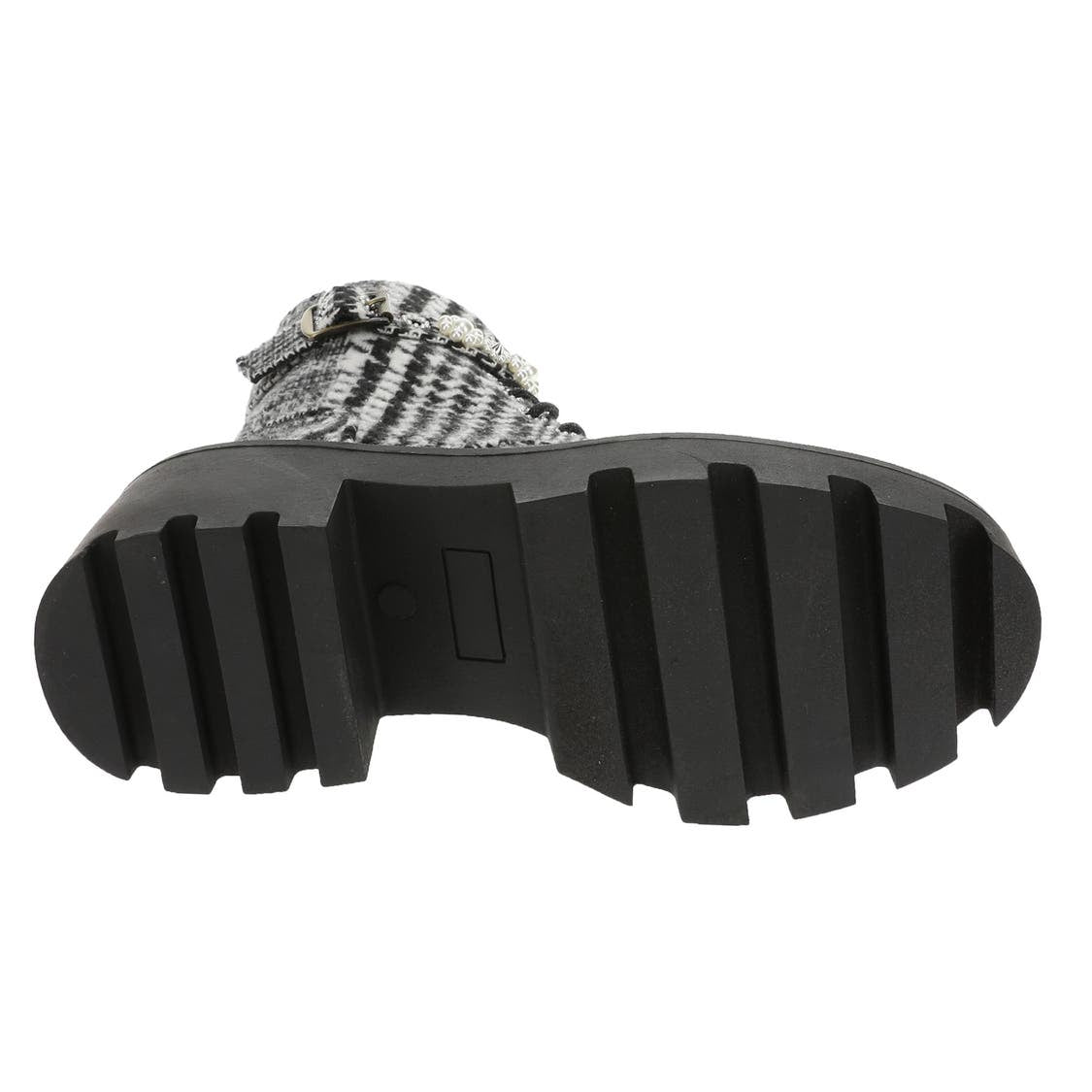 black and white houndstooth style design chunky heeled platform booth with pearl like embellishments on strap. Features side zipper and black shoe laces. Bottom view