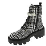 black and white houndstooth style design chunky heeled platform booth with pearl like embellishments on strap. Features side zipper and black shoe laces. Side zipper view