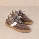 brown and white faux leather sneaker with animal print lace shoe lace detail pair side profile