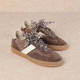brown and white faux leather sneaker with animal print lace shoe lace detail pair side profile