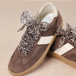 brown and white faux leather sneaker with animal print lace shoe lace detail pair