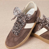 brown and white faux leather sneaker with animal print lace shoe lace detail pair
