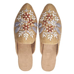 neutral tan colored slide mule with floral ribbon embroidery pair