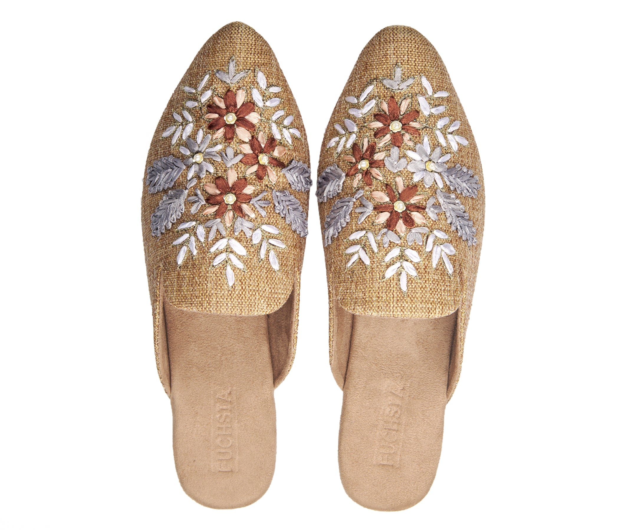 neutral tan colored slide mule with floral ribbon embroidery pair