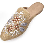 neutral tan colored slide mule with floral ribbon embroidery side profile
