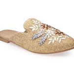 neutral tan colored slide mule with floral ribbon embroidery side front