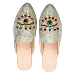 neutral colored slide mule with eye beaded embroidery detail pair
