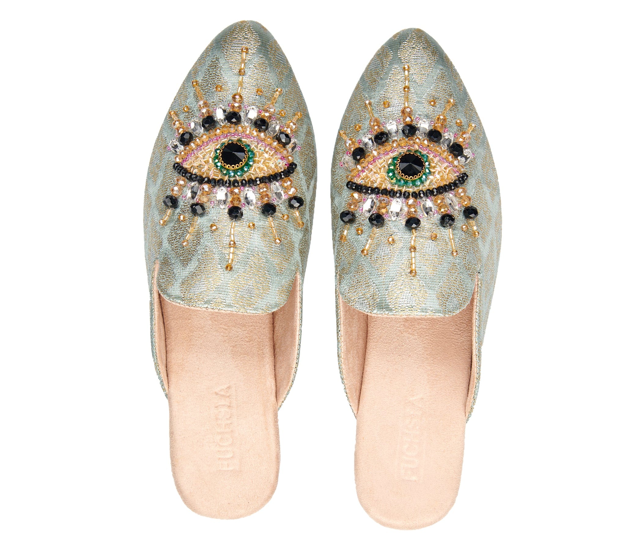 neutral colored slide mule with eye beaded embroidery detail pair