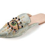 neutral colored slide mule with eye beaded embroidery detail side profile