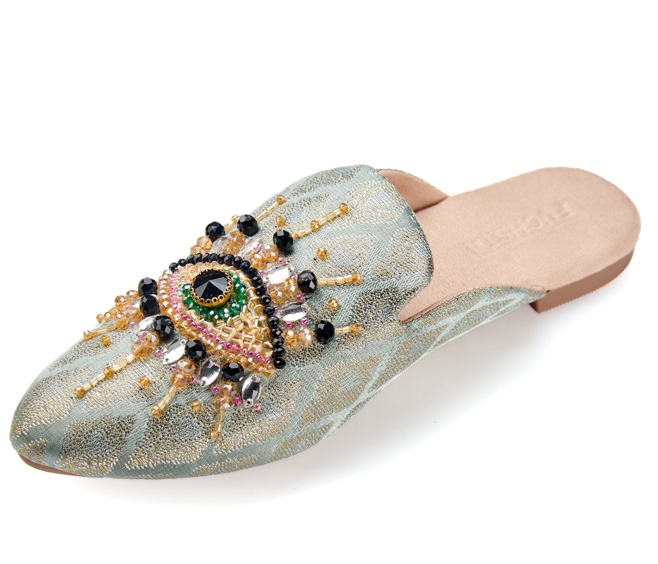 neutral colored slide mule with eye beaded embroidery detail side profile