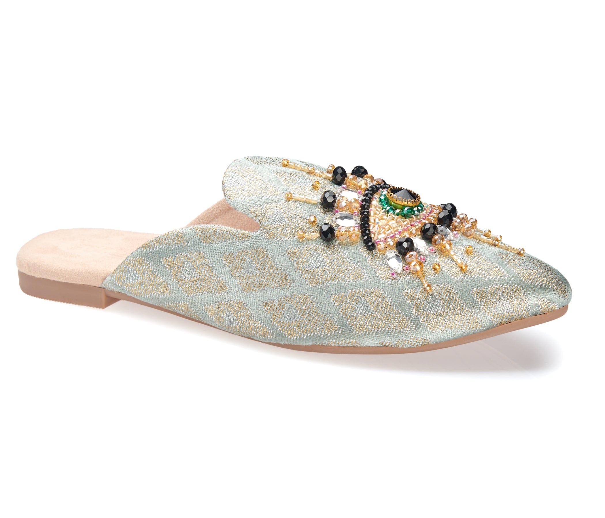 neutral colored slide mule with eye beaded embroidery detail side angle