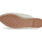 neutral colored slide mule with eye beaded embroidery detail bottom