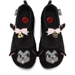 Black furry mary janes with cartoon lamb faces and decorative bow, bell, and pentagram elements on a white background