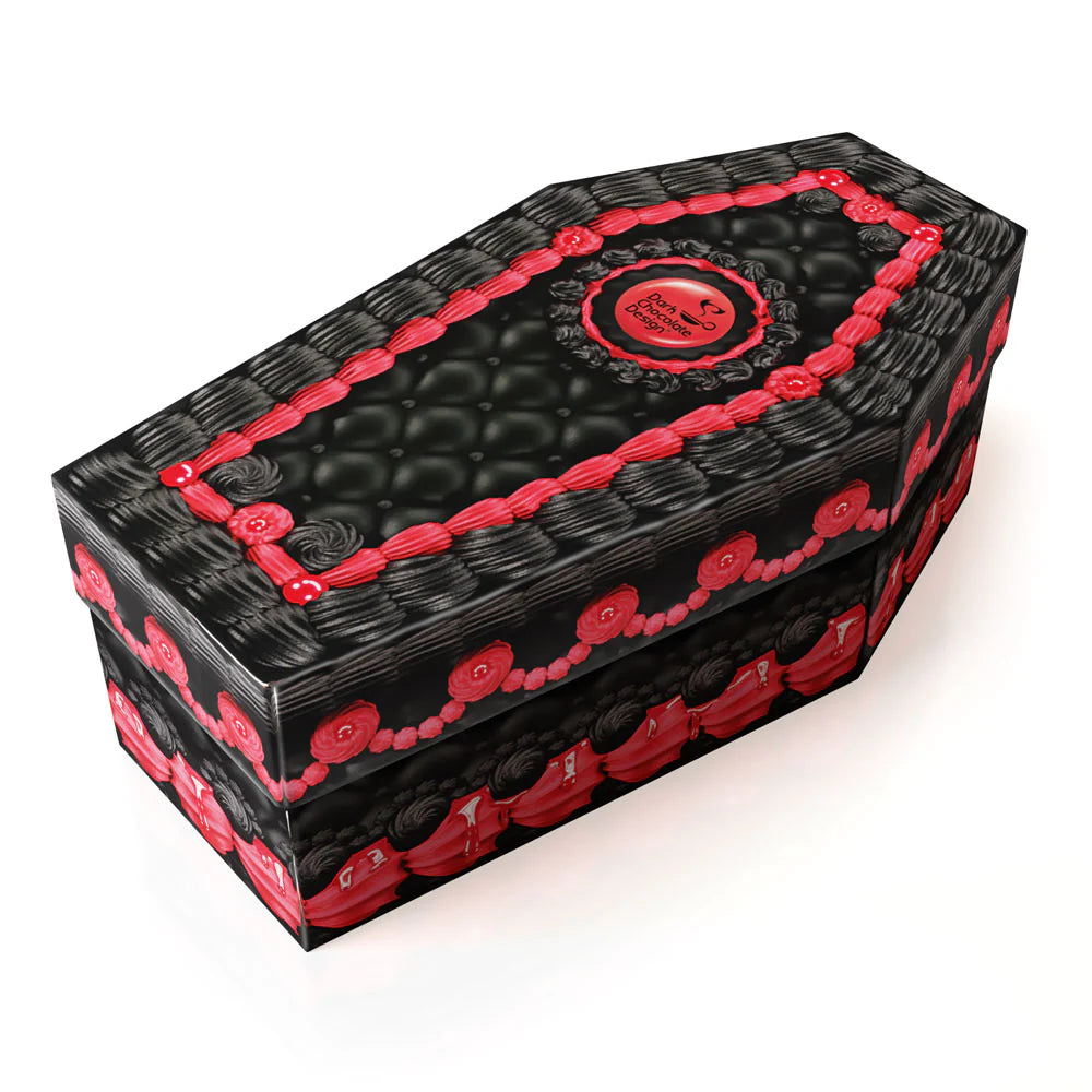 Black coffin-shaped shoe box with red decorative icing like elements on a white background