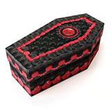 Black coffin-shaped shoe box with red decorative icing like elements on a white background