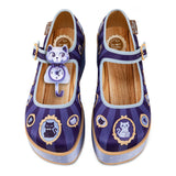 Pair of purple mary jane platform shoes with cat designs, and across the foot buckles on a white background