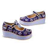 Pair of purple mary jane platform shoes with cat designs, and across the foot buckles on a white background left and right side profiles