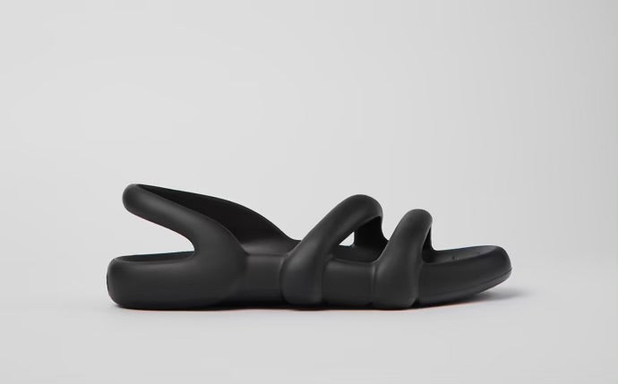 Black molded modern flat sandal from side
