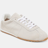 Italian-made sneaker featuring a trendy silhouette in ultra-soft suede. The SERINA sneaker in ivory features a rubber sole and white shoe laces side profile