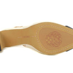 leather sling back pump heel in white and black from Vince Camuto bottom view