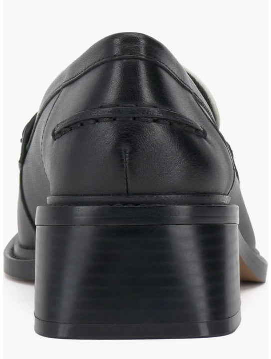 Black and cream colored leather loafer with heel back view.