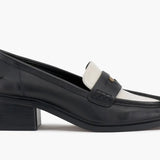Black and cream colored leather loafer with heel full side view