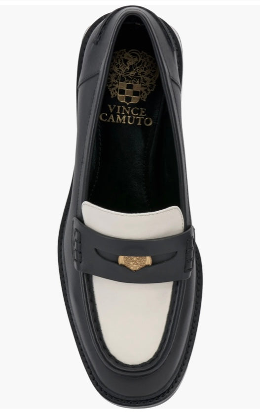 Black and cream colored leather loafer with heel full top view.