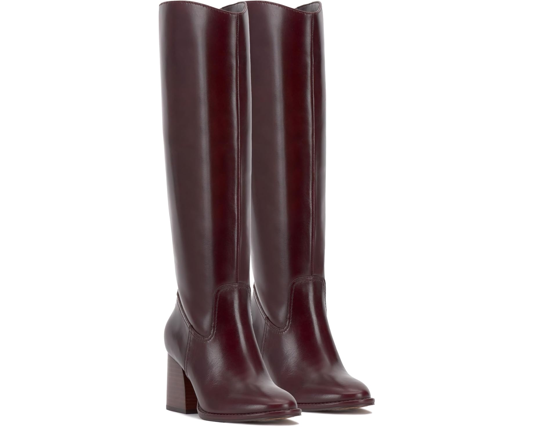 Brown knee-high tall shaft boot with soft round toe and a stacked block heel. Has zippered side closure and elastic inserts on the shaft for improved fit. The boot is lined with fabric and finished on the exterior with a leather-covered welt and rubber outsole pair