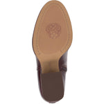 Brown knee-high tall shaft boot with soft round toe and a stacked block heel. Has zippered side closure and elastic inserts on the shaft for improved fit. The boot is lined with fabric and finished on the exterior with a leather-covered welt and rubber outsole bottom