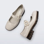 The June Mary Jane by Melissa features a neutral beige hue, slight heel, fun bubblegum scent, and large buckle detail top side view