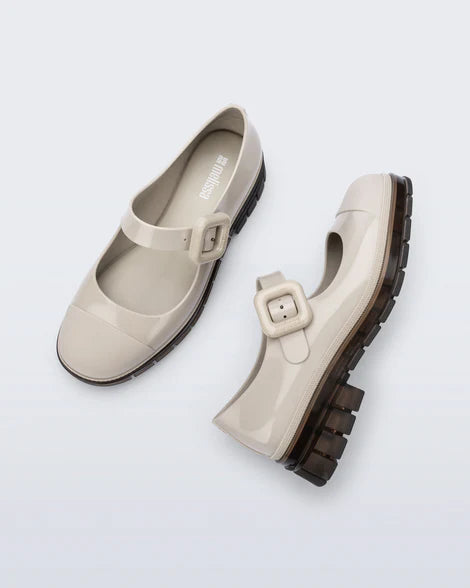 The June Mary Jane by Melissa features a neutral beige hue, slight heel, fun bubblegum scent, and large buckle detail top side view