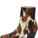 Brown and white cow print ankle boot on a white background