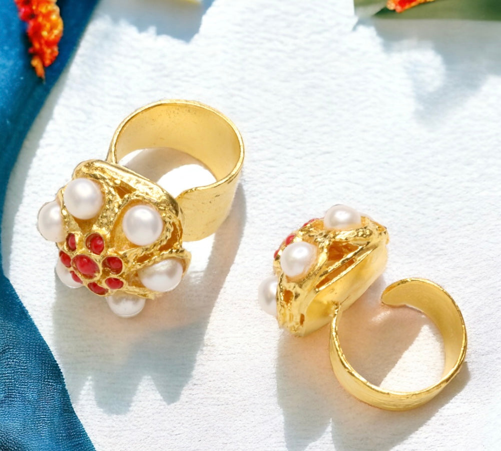 Gold rings with round top and pearl like beading with red stone accents