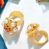 Gold rings with round top and pearl like beading with red stone accents