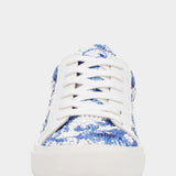 Blue and white patterned sneaker on a white background
