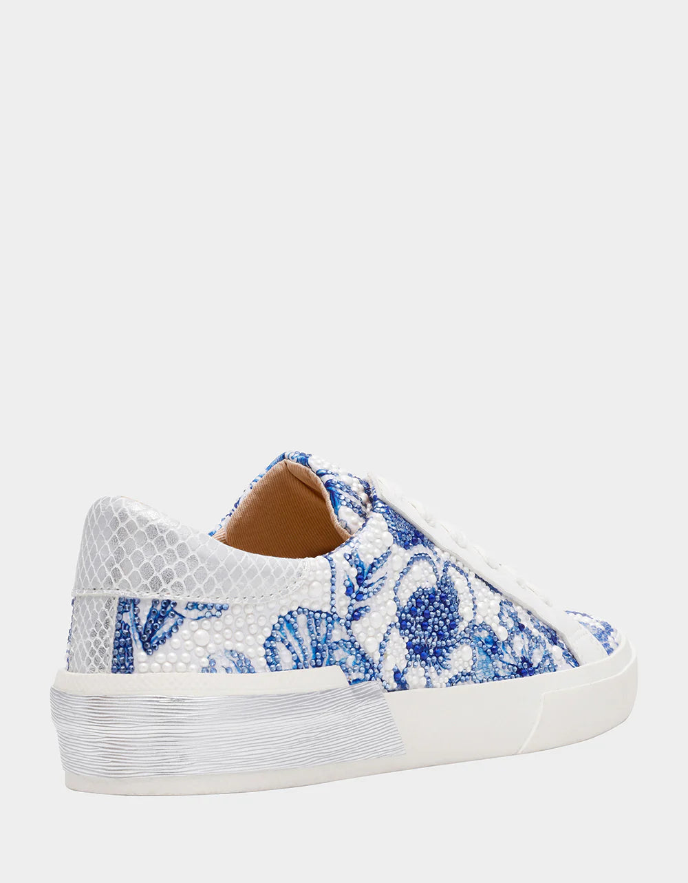 Sneaker with blue floral pattern on a white background