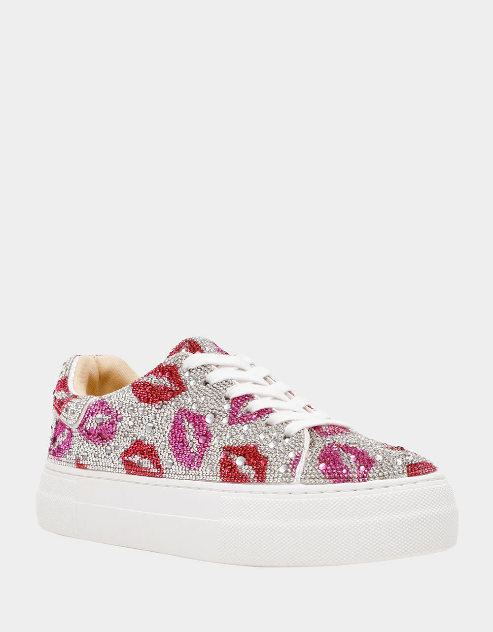 White sneaker with pink and red floral patterns and rhinestones on a white background