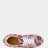 Sneaker with pink and red pattern on a white background
