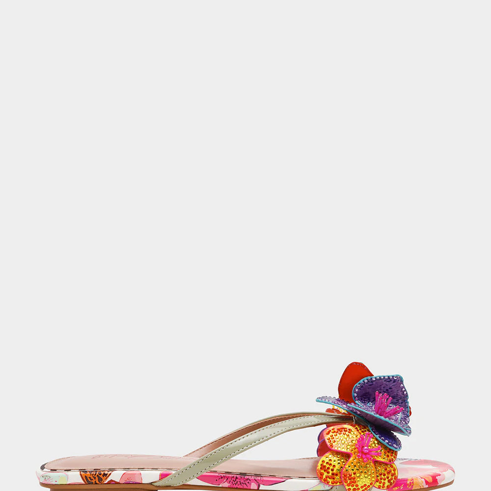 Colorful sandal with gold thong strap and butterfly embellishments close-up
