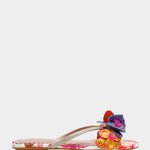 Colorful sandal with gold thong strap and butterfly embellishments close-up