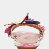 Colorful sandal with gold thong strap and butterfly embellishments heel view