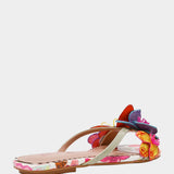 Colorful sandal with gold thong strap and butterfly embellishments side view