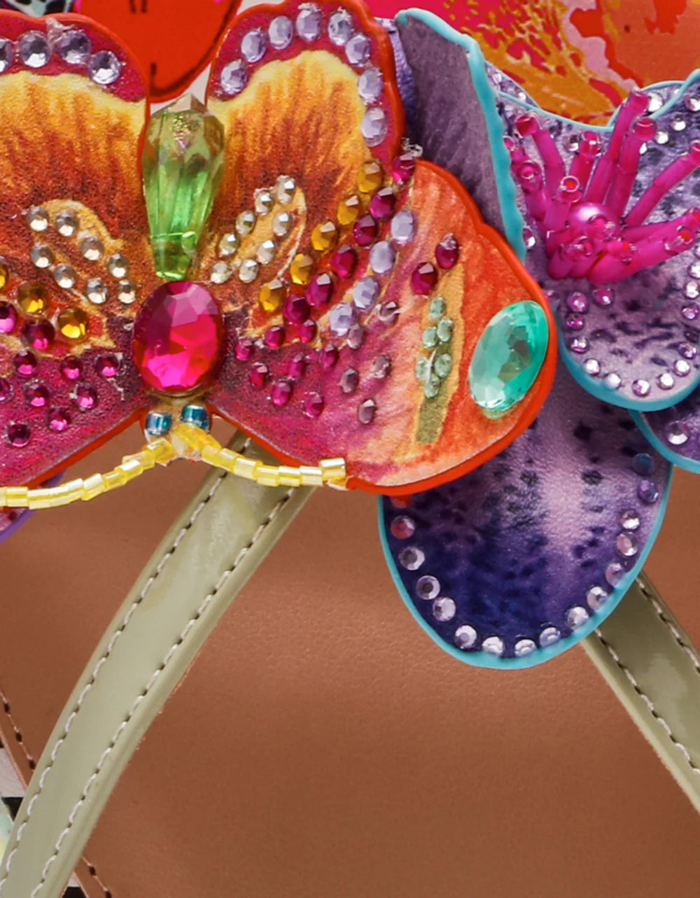Colorful sandal with gold thong strap and butterfly embellishments detail